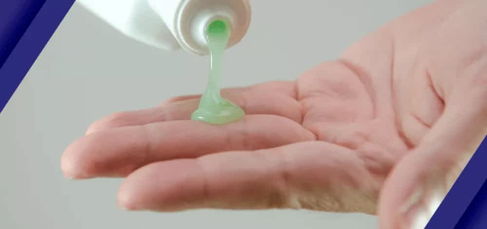 A person putting a thick liquid substance on the hand